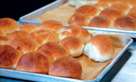 Kicking Horse Job Corps culinary arts students serve up fresh rolls as a treat at the open house on Sept. 26. Instructor Willie Caye teaches culinary classes at Kicking Horse.  