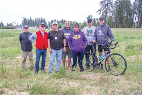 From left are Marty Zobel with CSKT Natural Resources, Dave Atkins of CCL, Mike Durglo, Jim Durglo, Robert Schulz and Les Trahan of Eagle Pass Drum and cyclist Bill Barron, CCL.