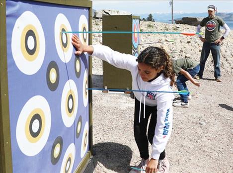 Members of the Dayton Elementary School archery team practice at the new archery range at Big Arm State Park.