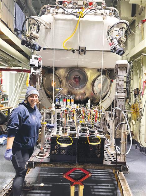 Montana State University student Sylvia Nupp prepares sampling equipment on the deep sea submersible vehicle Alvin during a research trip to the Pescadero Basin in the Gulf of California with MSU postdoctoral researcher Andy Montgomery.