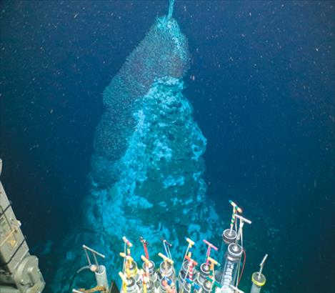 An image of a deep see hydrothermal vent structure named Matterhorn is captured by Montana State University graduate student Sylvia Nupp and post doctoral researcher Andy Montgomer during a dive to ~3700 meters in the Pescadero Basin in the Gulf of California. Sampling equipment on the DSV Alvin can be see in the foreground.