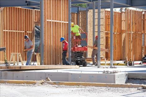 Crews put up interior walls.