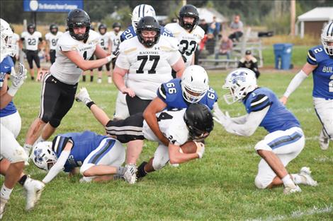 Mission Bulldogs stop Blackhawk forward play with a tackle. The Blackhawks won the game against the Bulldogs, 6-34