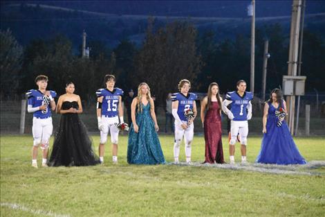 Mission’s homecoming court waits for the king and queen announcement from the football field during halftime.