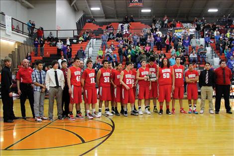 The Arlee Warrior basketball team poses for a photo.