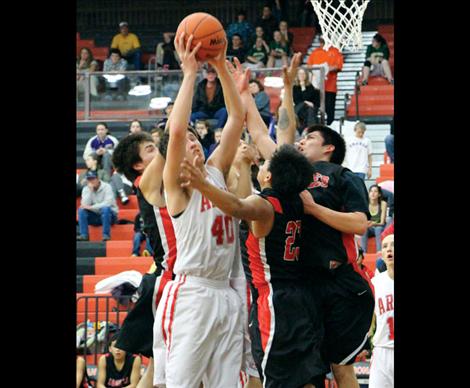 Arlee Warriors and Two Eagle Eagles battle for a rebound.