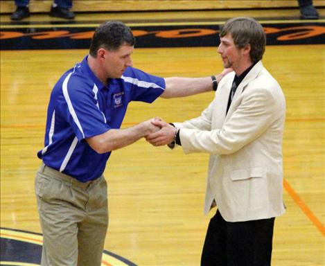 Superior Coach Chris Toivonen greets Arlee Coach Zanen Pitts.