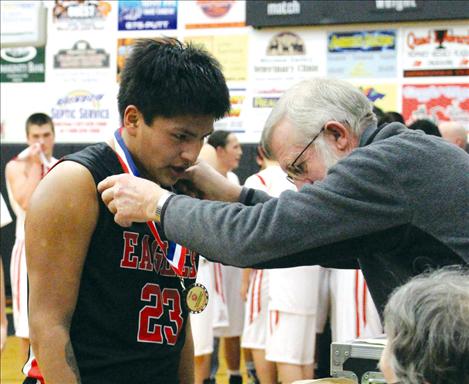 Two Eagle River athlete Eugene Parker receives a sportsmanship award.