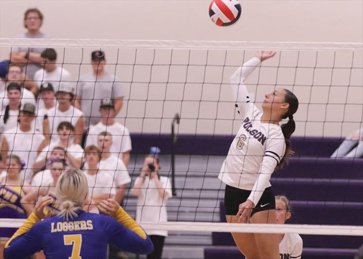 Sammy Rensvold slams the ball over the net in a September game against the Lady Libby Loggers.