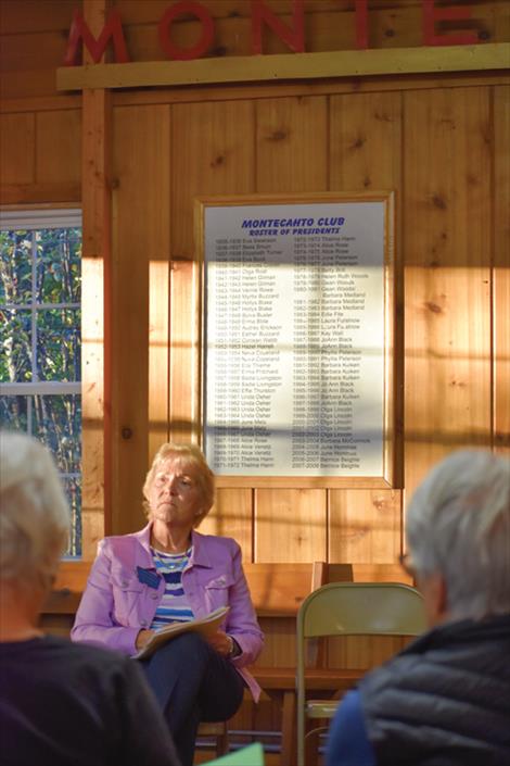 Linda Reksten, Republican candidate for House District 13, listens to the emcee ask another question.