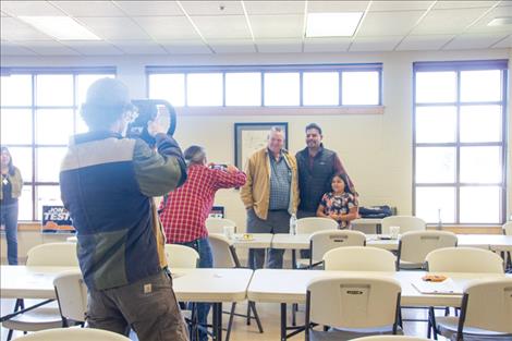 SKC student senate representative Jacop Wayne poses for a photo with Sen. Tester and future generation voter.