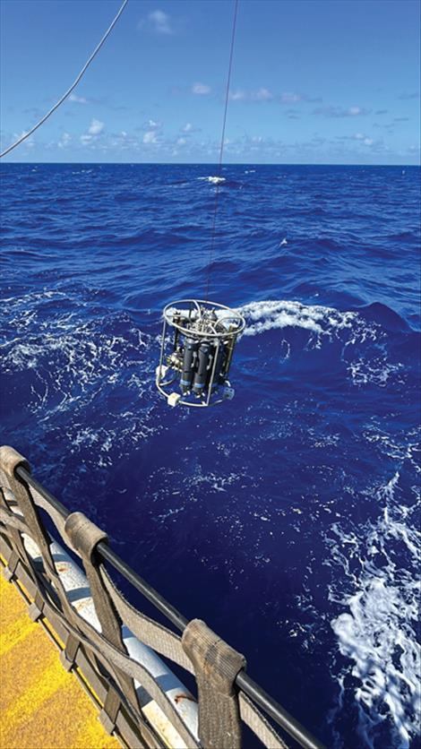 A conductivity, temperature and depth rosette, specially designed to collect water with trace amounts of iron and other metals without contamination, is deployed during an expedition in the North Pacific Ocean.