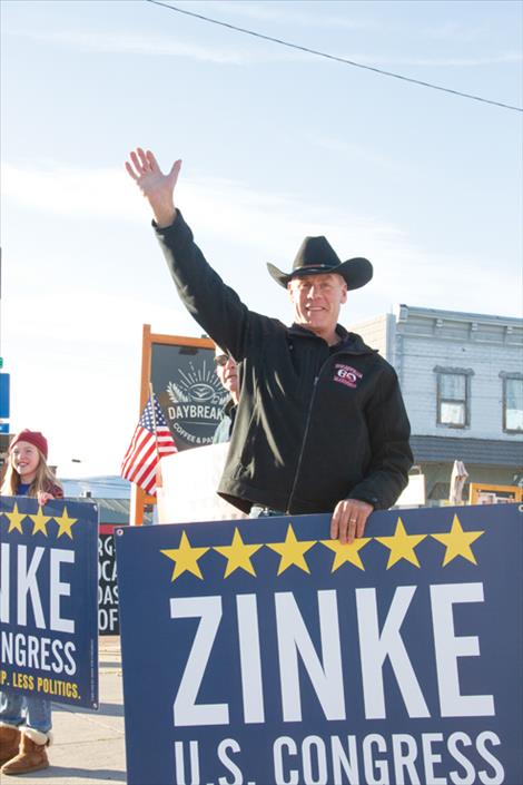 Ryan Zinke, Republican candidate for Montana’s Western District seat in the U.S. House of Representatives, waves to motorists in downtown Polson last Friday.