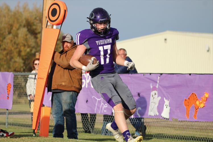 Charlo Viking Karson Cox runs the ball down the field during the Oct. 25 homecoming football game. The Vikings fell to the Darby Tigers, 24-57