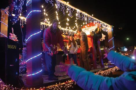 Candy is tossed from the Stutzman’s float to eager children who lined either side of the street.