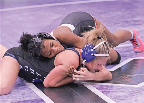 Ronan Maiden wrestler Aliyah Stewart, top, competes in the Owen  Invitational.