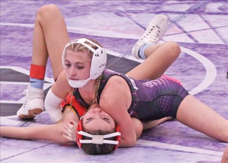 Avari Stone pins her opponent in the 105 weight category. More photos on page 17.