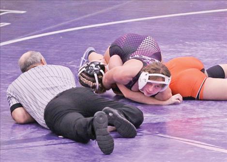 Polson wrestler Cheyenne Blake works to pin a Ronan wrestler at the Dec. 6 Owen Invite.