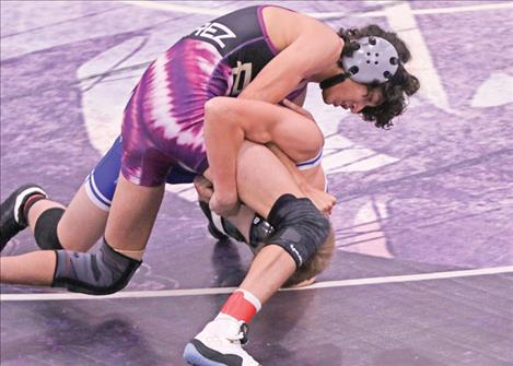 Geraldo Alvarez, Polson wrestler, stays on top of his opponent.