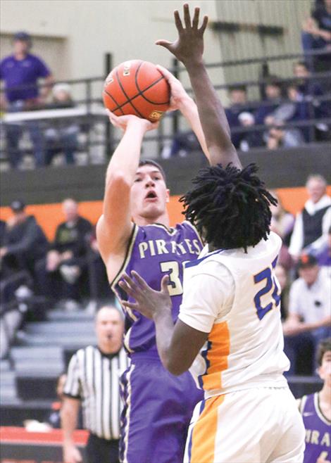 Polson Pirate Cody Haggard takes a jump shot.