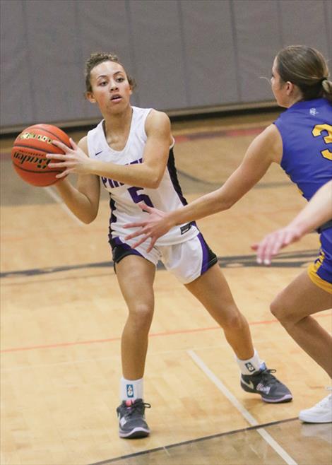  Polson Lady Pirate Rylee Taylor-Jefferson looks to make a pass on the inside.