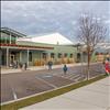 Students get off the bus after school and walk into the Boys and Girls Club, Polson site.