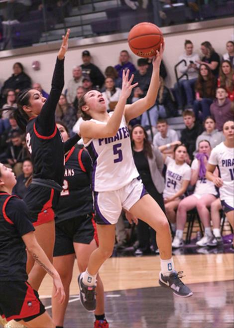 Polson Lady Pirate Rylee Taylor-Jefferson puts up two points in a game against the Browning Lady Indians.