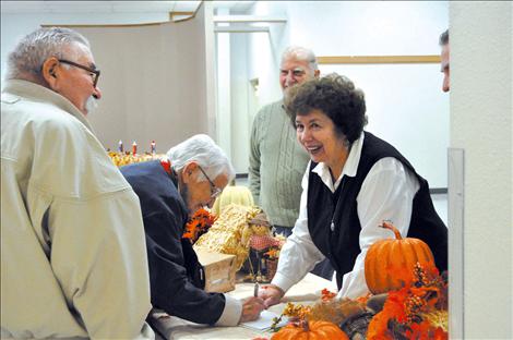 Diane Grant greets one of 300 dinner guests.