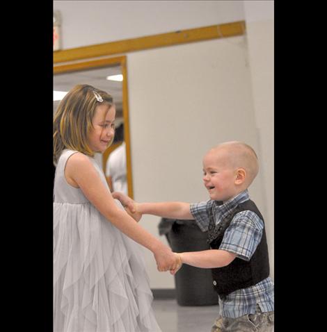 Sierra and Brander Symington giggle on the dance floor.