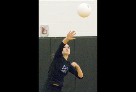 Libero Emyli Gillingham fires off a serve during divisional  tournament play two weeks ago.