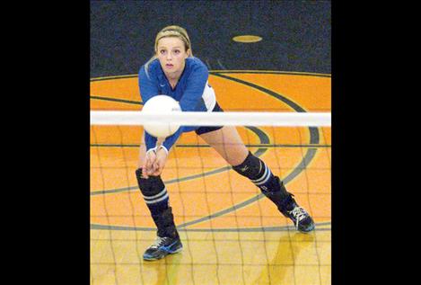 Senior Stephanie Lewandowski plays with focus during the divisional tournament.