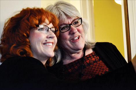 Mary Rutherford, president and chief executive officer of the Montana Community Foundation in Helena, left, celebrates with Jenifer Blumberg, founder of The Nest, at Thursday’s open house in St. Ignatius.