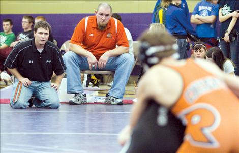 Ronan head coach Cory Johnston and assistant coach Monte Cheff watch a Ronan athlete’s match at the Dec. 1 Polson Invitational.