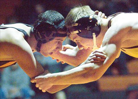 Jesse Partida, left, grapples with Florence’s Jace Pancake during Ronan’s home mixer last Thursday. Partida lost the 145-pound match by pin in 2:31 but went on to defeat Deer Lodge wrestler Tristan Huff in the  second round. 