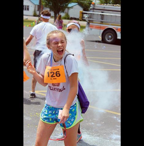 Hannah Rowe gets hit with powder.