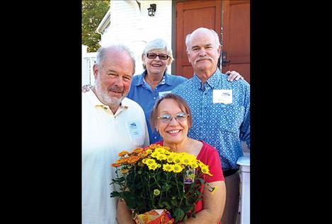 Steve Sherick and Karen Dunwell, left, honored Bill Olson, past president, and Gay Cochran, manager, of the Flathead Historical Museum.