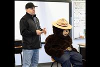 Firefighters, Smokey Bear read with students