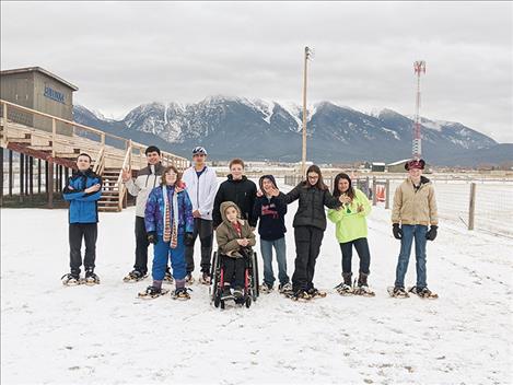 Mission Bulldog Special Olympic team members pose for a quick photo before a winter event.