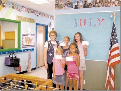 Winners of the VFW Ladies Auxiliary coloring contest are, left front, Kiana King; Eva Miller; Shanel Manuel and Tyariah Morigeau and Margaret Fay, Ladies’ Auxiliary.